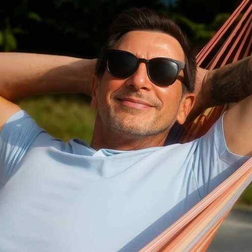 Relaxed entrepreneur lying in a hammock, symbolising how DigiBuur’s AI automation makes running a business easier and more efficient.